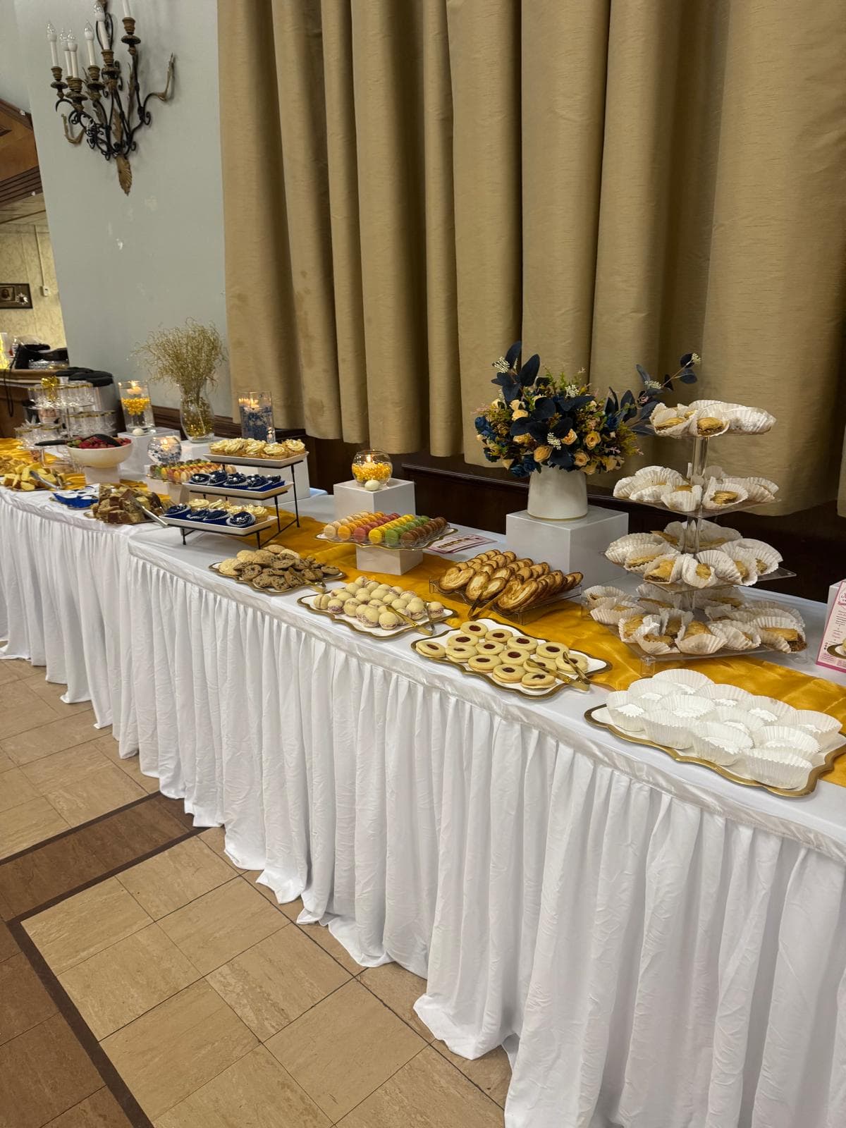 A catered dessert table by Mimi Sweets at a special event