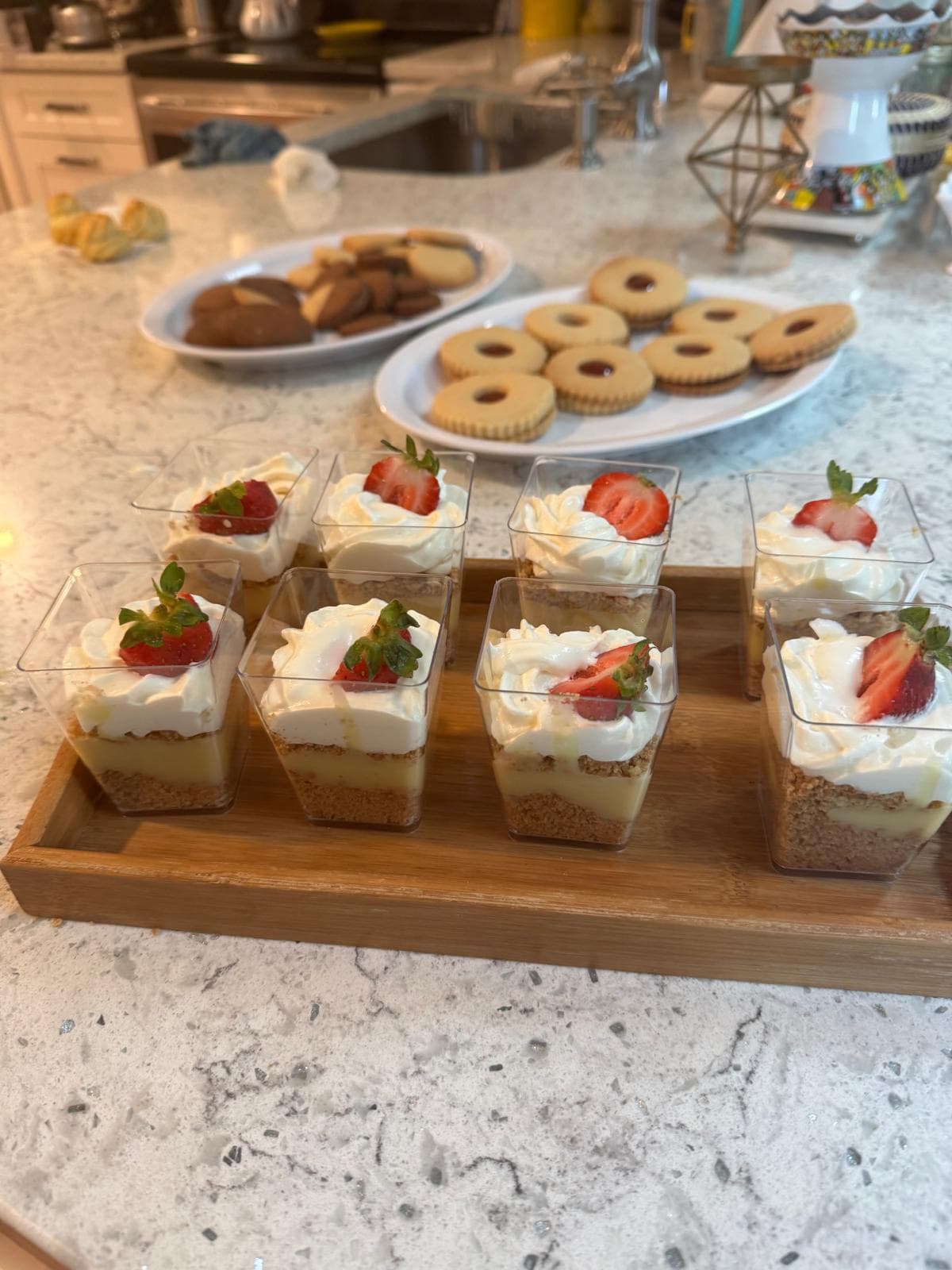 Individual cheesecake cups topped with strawberry slices