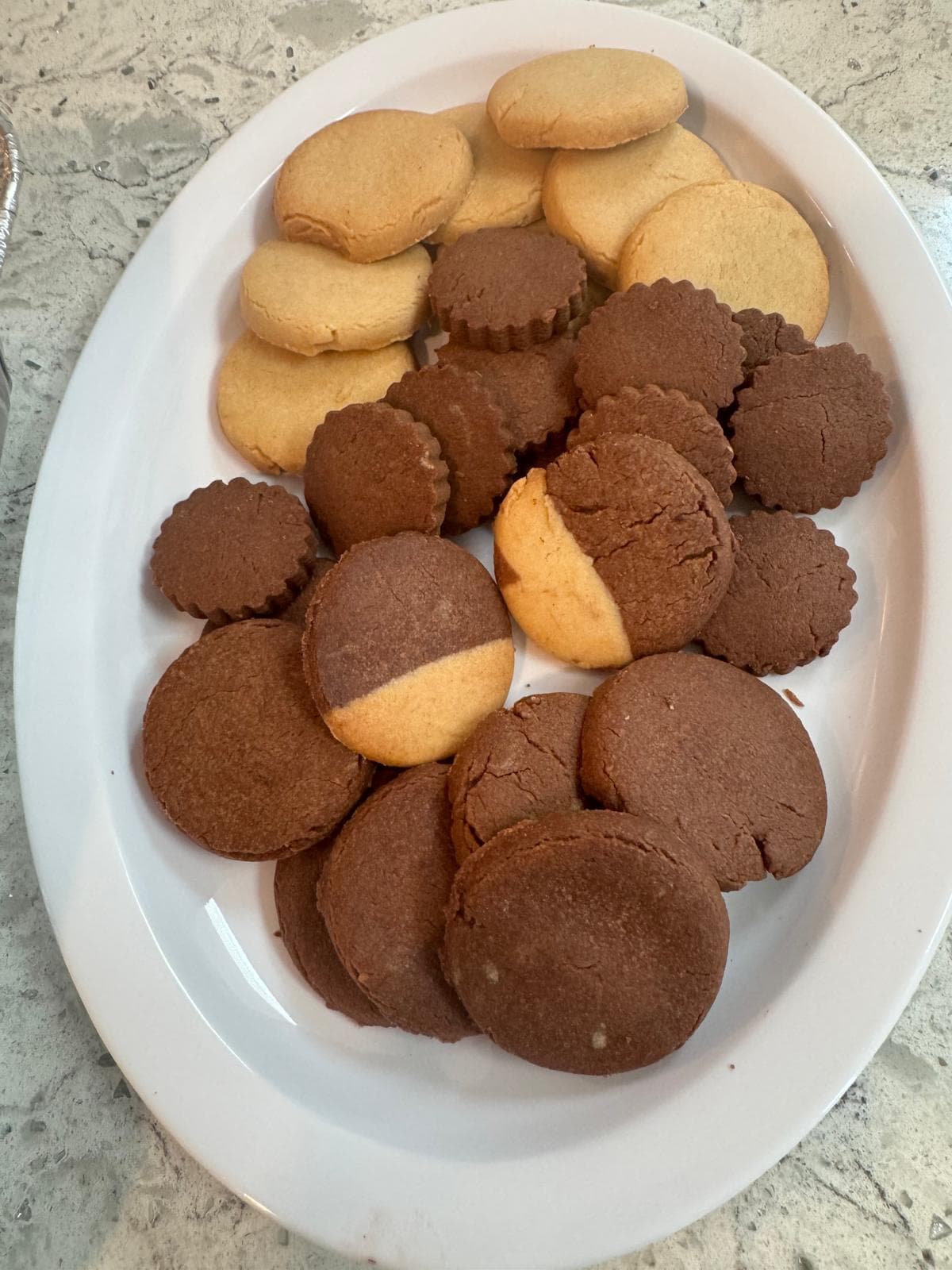Chocolate and vanilla two-tone butter cookies on a plate
